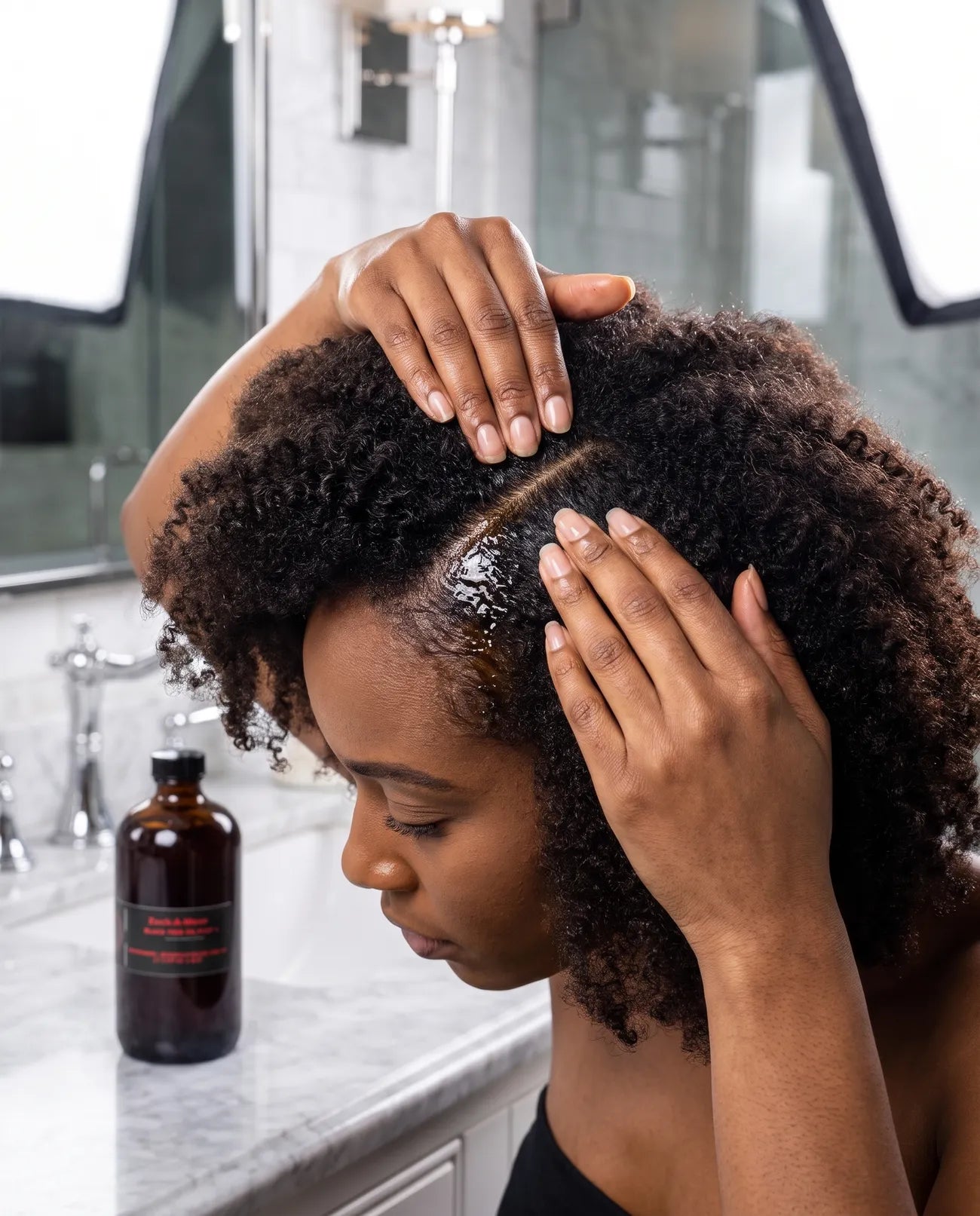 The three AMEXEM 4 oz products laid out on a bathroom counter